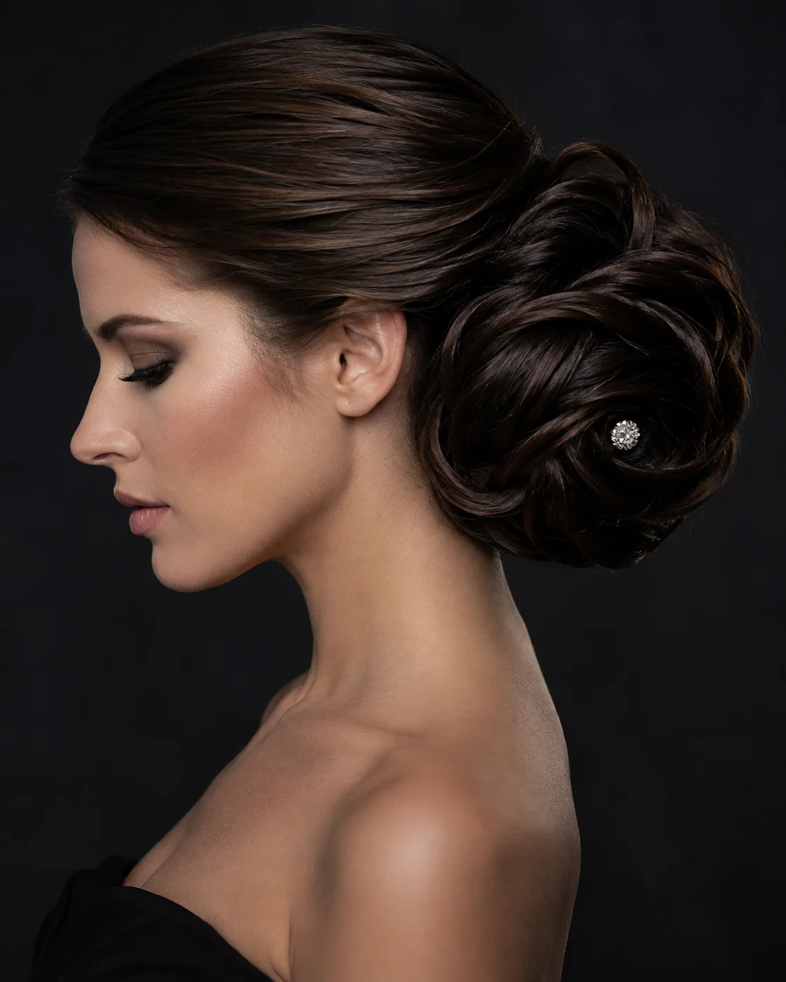 Elegant sculpted updo with jeweled detail